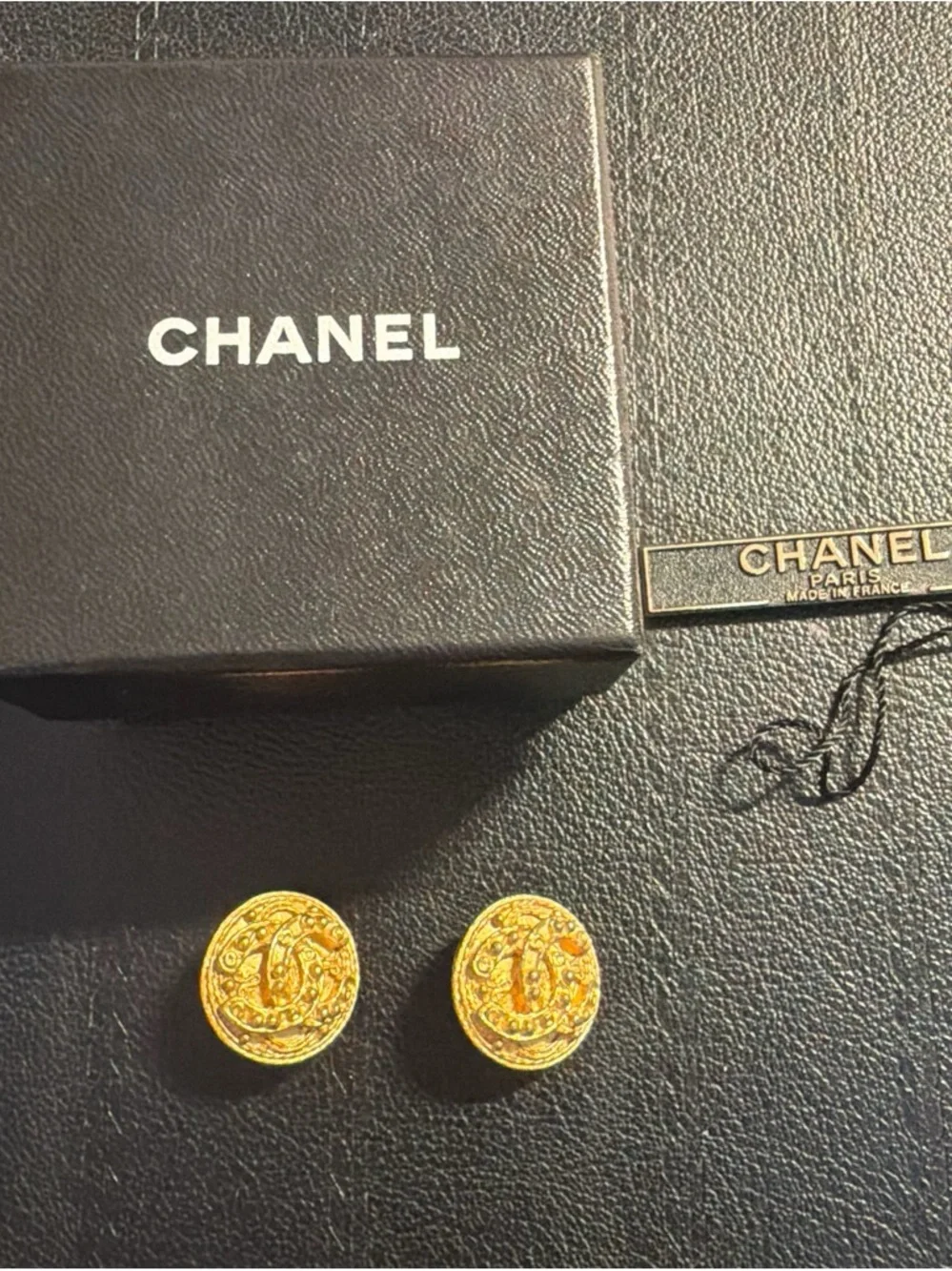 CHANEL Gold Tone Embossed Logo Cuff Links
